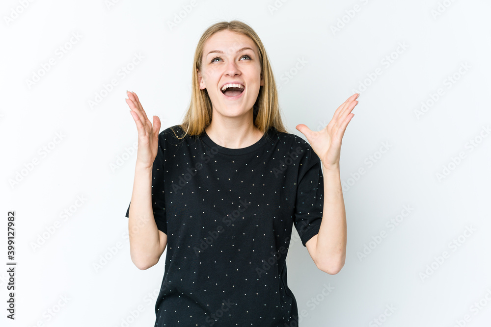 Young blonde woman isolated on white background laughs out loudly keeping hand on chest. Young blonde woman isolated on white background laughs out loudly keeping hand on chest.