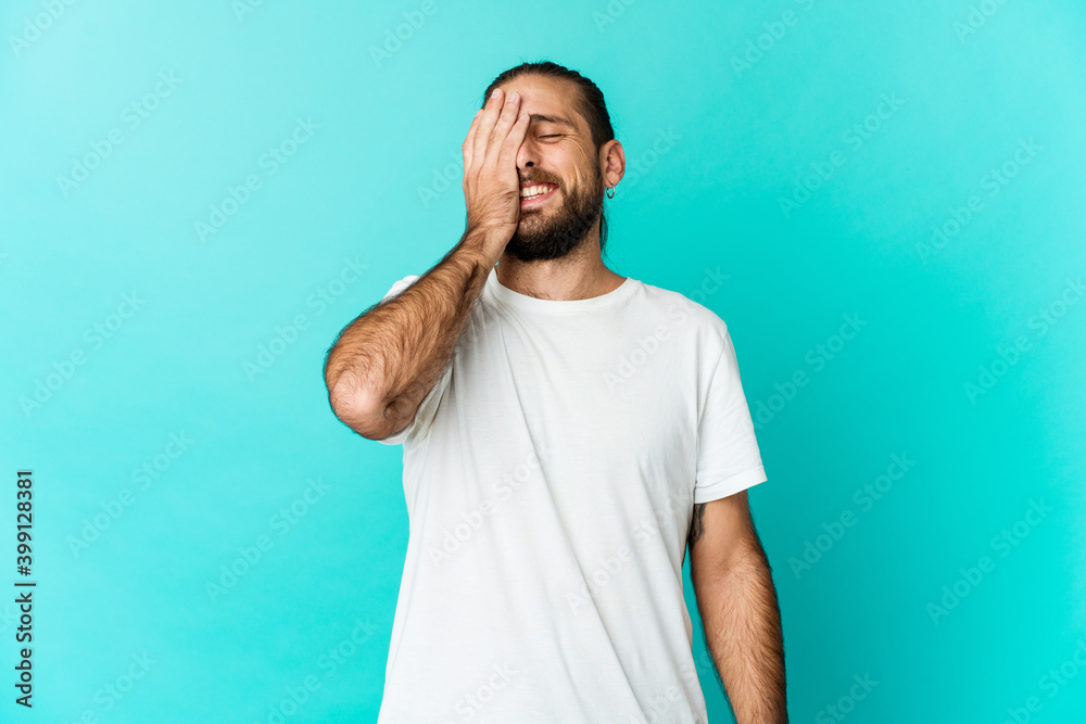 Young man with long hair look laughing happy, carefree, natural emotion. Young man with long hair look laughing happy, carefree, natural emotion.