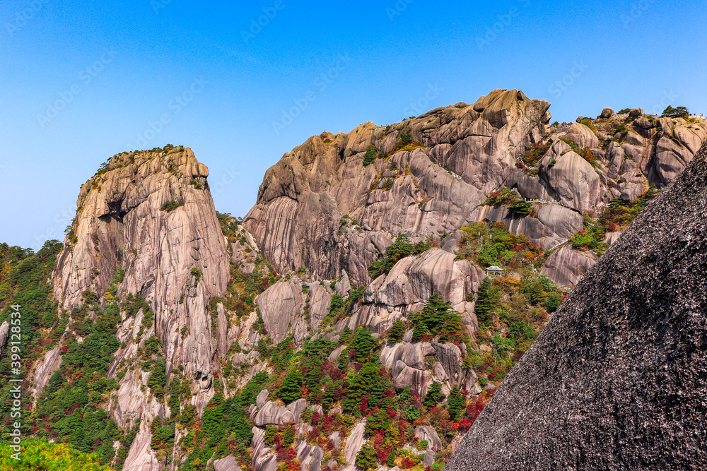 Scenic and panoramic view of
Mount Huangshan cliffs and forest of Masson pine with various colours typical of the autumn season, Anhui, China Yellow mountain Scenic and panoramic view of
Mount Huangshan cliffs and forest of Masson pine with various colours typical of the autumn season, Anhui, China Yellow mountain