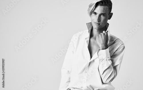 elegant man in shirt with tie light background portrait cropped view