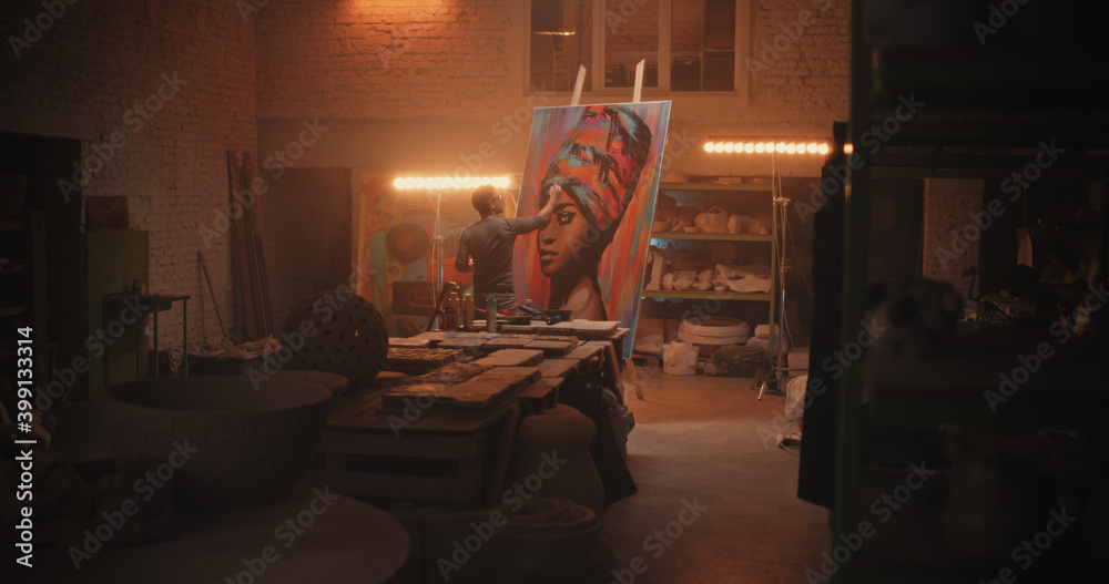 Man painting portrait of African woman