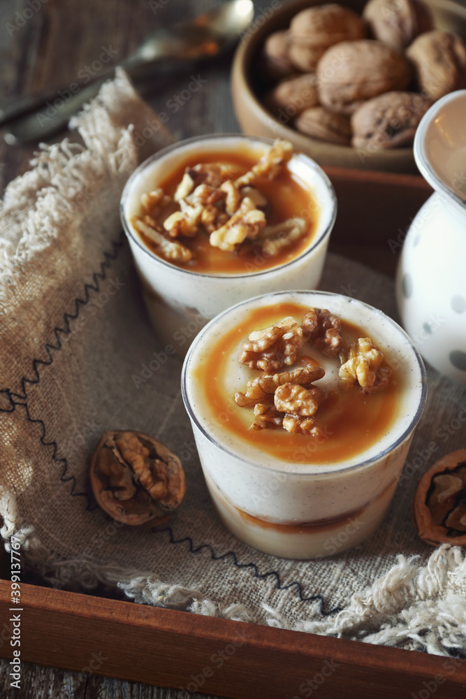 Vanilla dessert with caramel and walnuts, two portions Vanilla dessert with caramel and walnuts, two portions