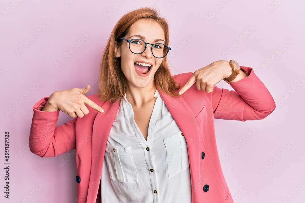 Young caucasian woman wearing business style and glasses looking confident with smile on face, pointing oneself with fingers proud and happy.