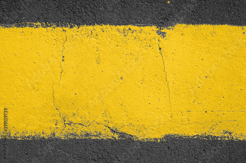 strip of yellow paint on the pavement. Use as frame or background