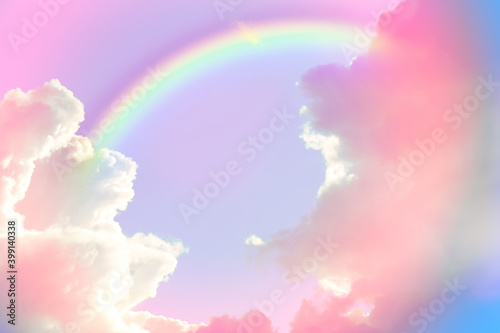 Amazing sky with rainbow and fluffy clouds  toned in unicorn colors