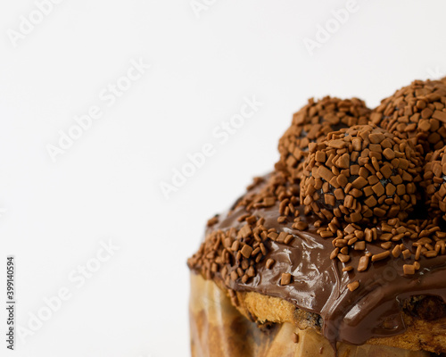 Brigadeiro stuffed sweet bread with chocolate balls isolated on the right with macro lens