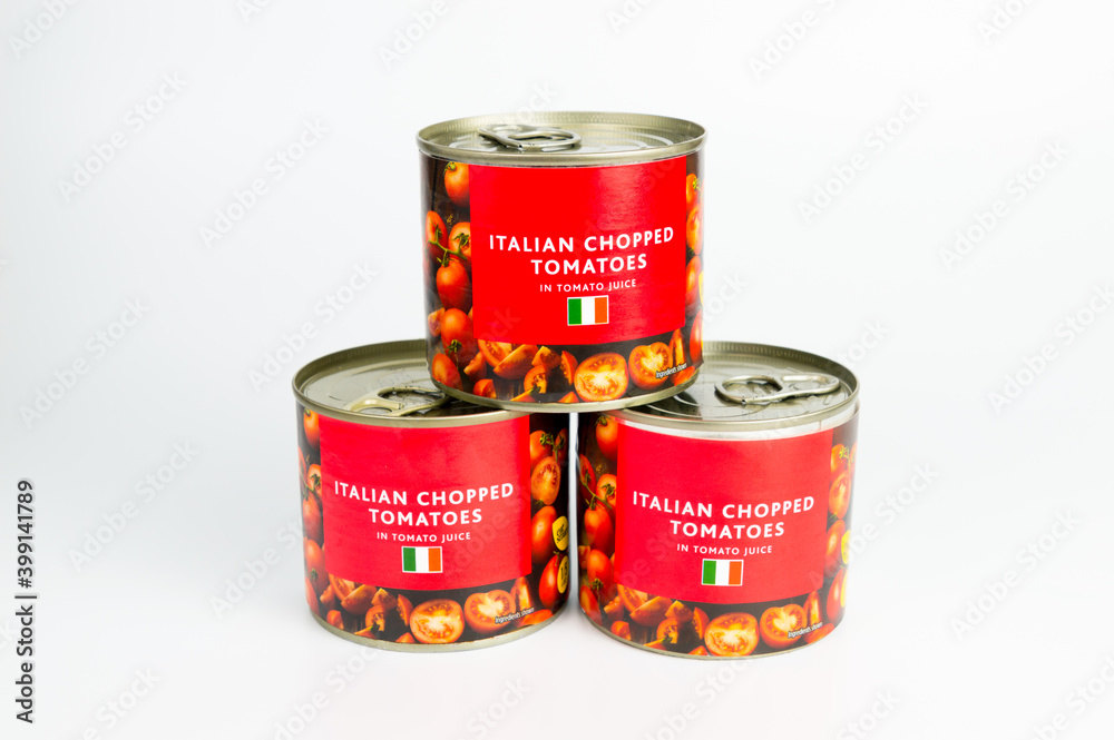Tinned Tomatoes or Canned Tomatoes stacked up Tinned Tomatoes or Canned Tomatoes stacked up