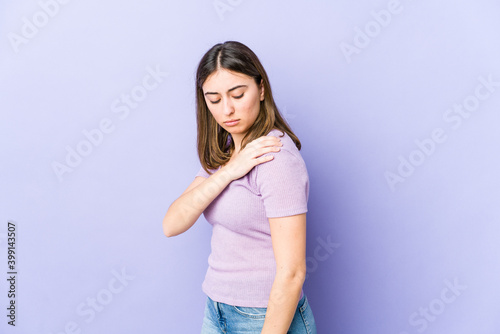 Young caucasian woman having a shoulder pain.
