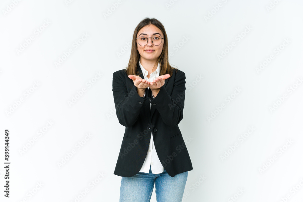 Young caucasian business woman holding something with palms, offering to camera. Young caucasian business woman holding something with palms, offering to camera.