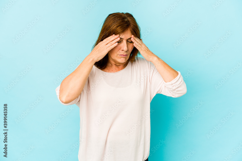 Senior caucasian woman isolated having a head ache, touching front of the face. Senior caucasian woman isolated having a head ache, touching front of the face.