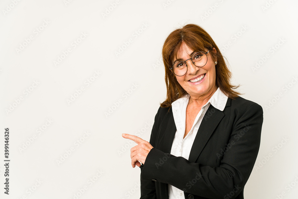 Middle age caucasian business woman isolated smiling and pointing aside, showing something at blank space. Middle age caucasian business woman isolated smiling and pointing aside, showing something at blank space.