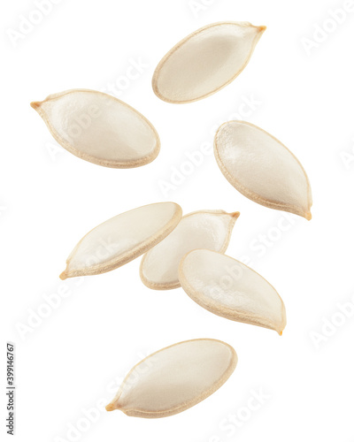 Falling Pumpkin seeds, isolated on white background, clipping path, full depth of field