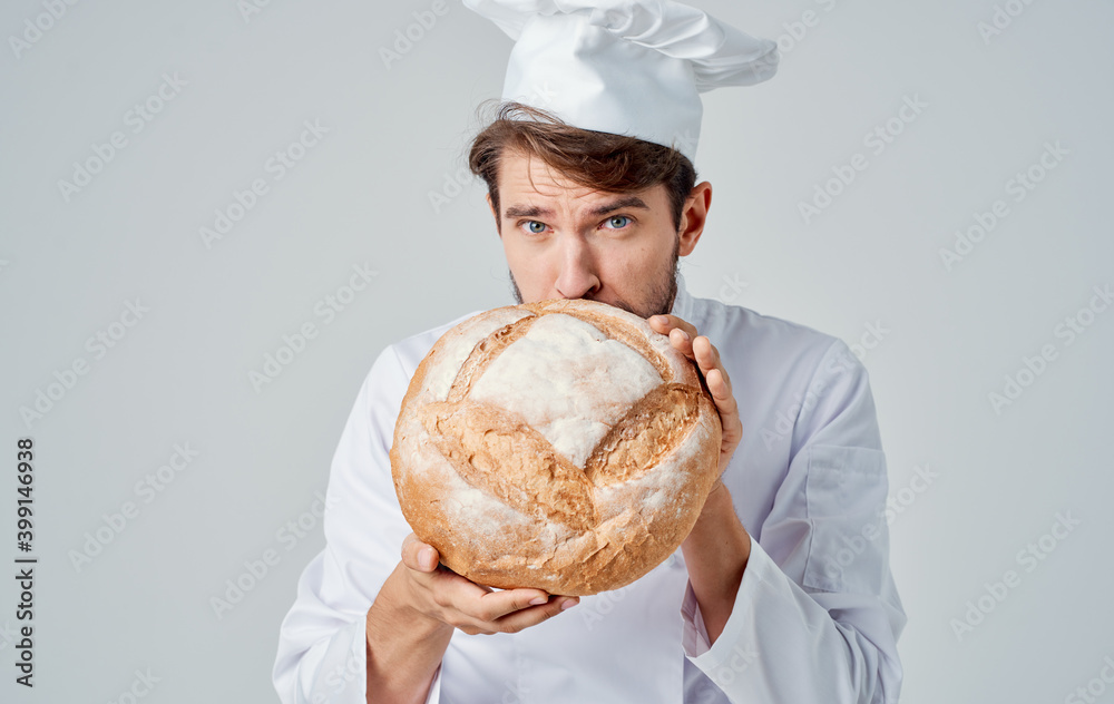 Man with brisk fresh bread chef professional headdress food Man with brisk fresh bread chef professional headdress food