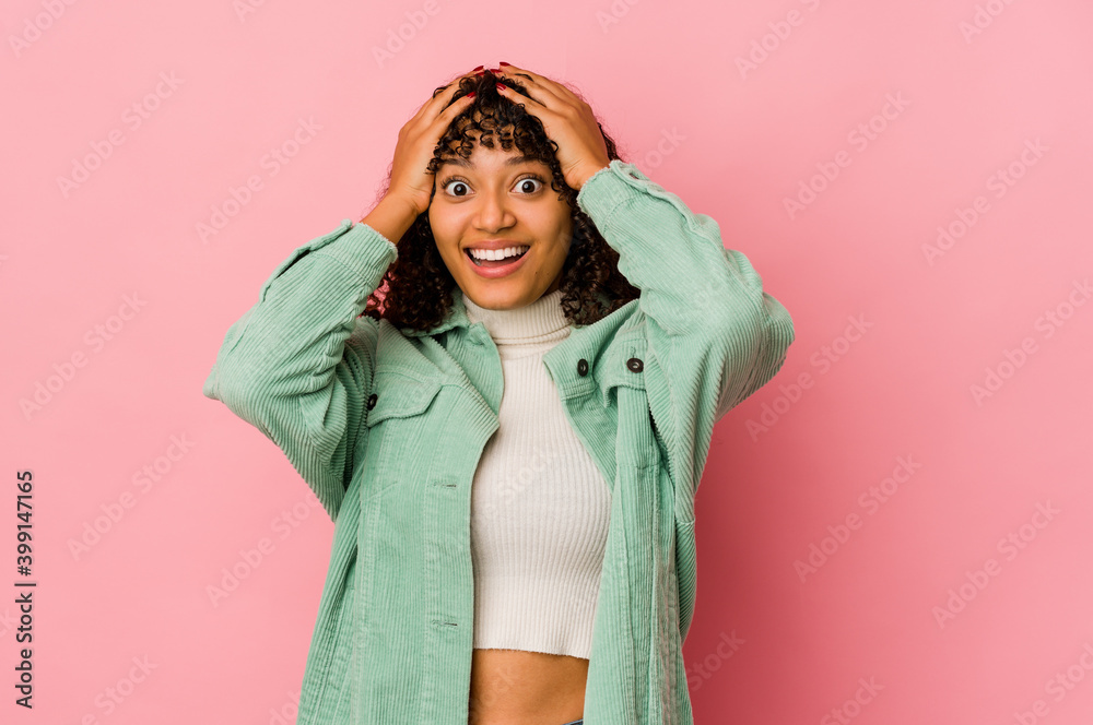 Young african american afro woman isolated screaming, very excited, passionate, satisfied with something. Young african american afro woman isolated screaming, very excited, passionate, satisfied with something.