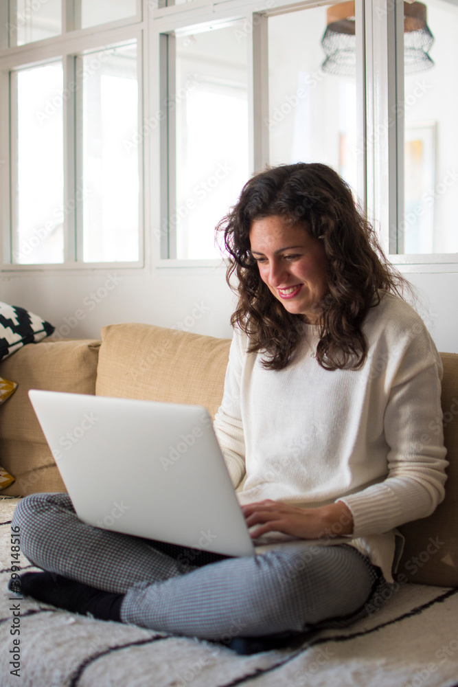 Young woman working from home with laptop Young woman working from home with laptop