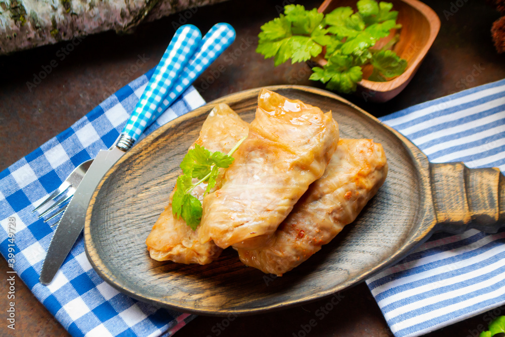 fried cabbage stuffed with meat on a rustic background fried cabbage stuffed with meat on a rustic background