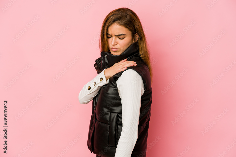 Young skinny caucasian teenager girl having a shoulder pain. Young skinny caucasian teenager girl having a shoulder pain.