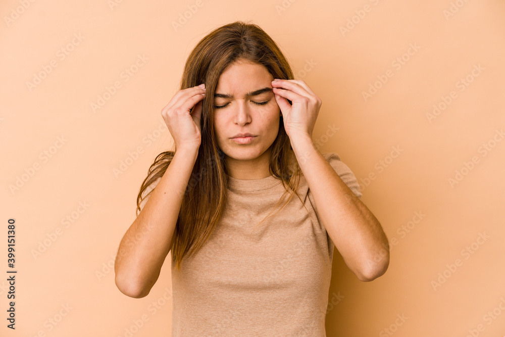 Young skinny caucasian teenager girl touching temples and having headache. Young skinny caucasian teenager girl touching temples and having headache.