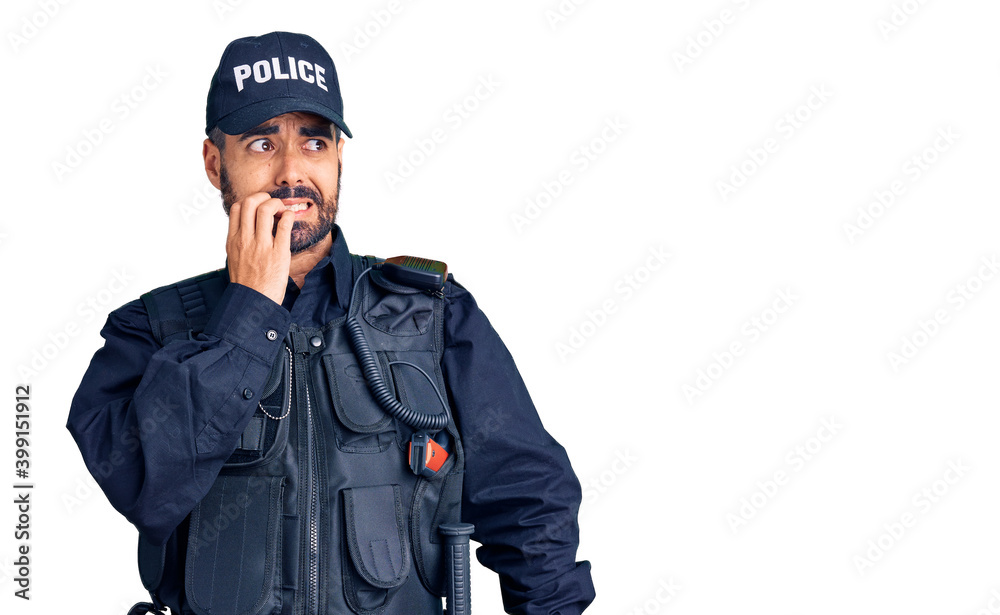 Young hispanic man wearing police uniform looking stressed and nervous with hands on mouth biting nails. anxiety problem. Young hispanic man wearing police uniform looking stressed and nervous with hands on mouth biting nails. anxiety problem.