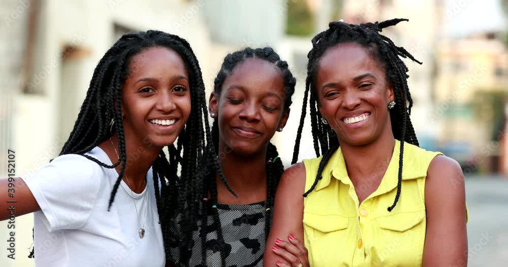 Mother and teen daughters laughing together. Mom and girls gossiping Mother and teen daughters laughing together. Mom and girls gossiping