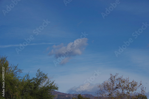 Panoramic view of the southern California coastal Santa Ynez mountain range und blue sky with some clouds in December photo