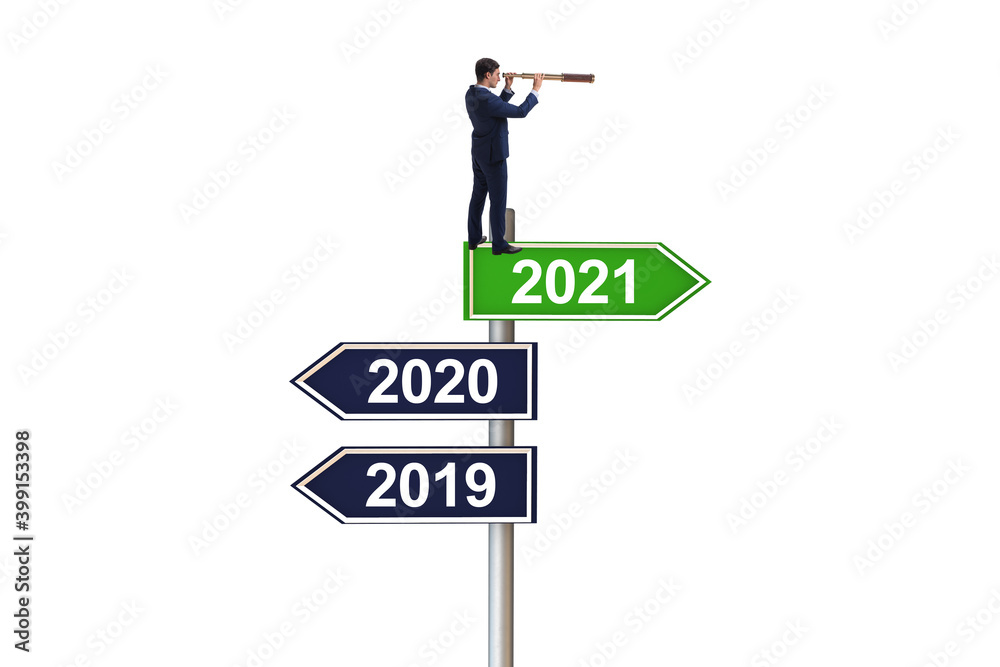 Road sign and businessman with 2020 and 2021 Road sign and businessman with 2020 and 2021