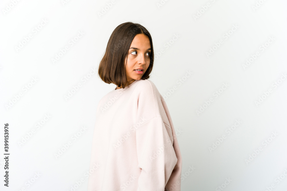 Young mixed race woman looks aside smiling, cheerful and pleasant. Young mixed race woman looks aside smiling, cheerful and pleasant.