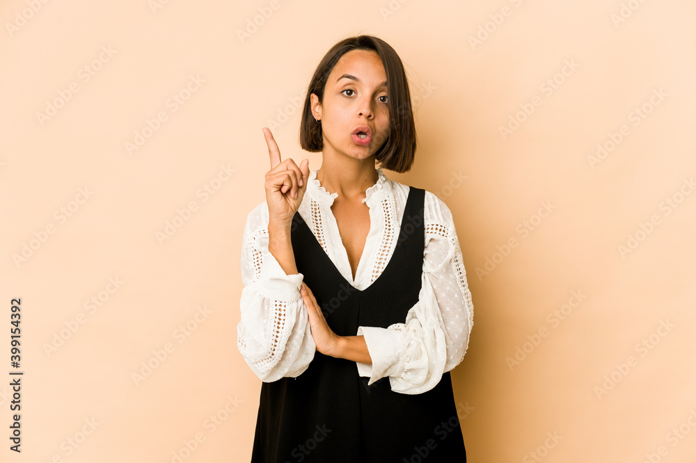 Young hispanic woman isolated having some great idea, concept of creativity. Young hispanic woman isolated having some great idea, concept of creativity.