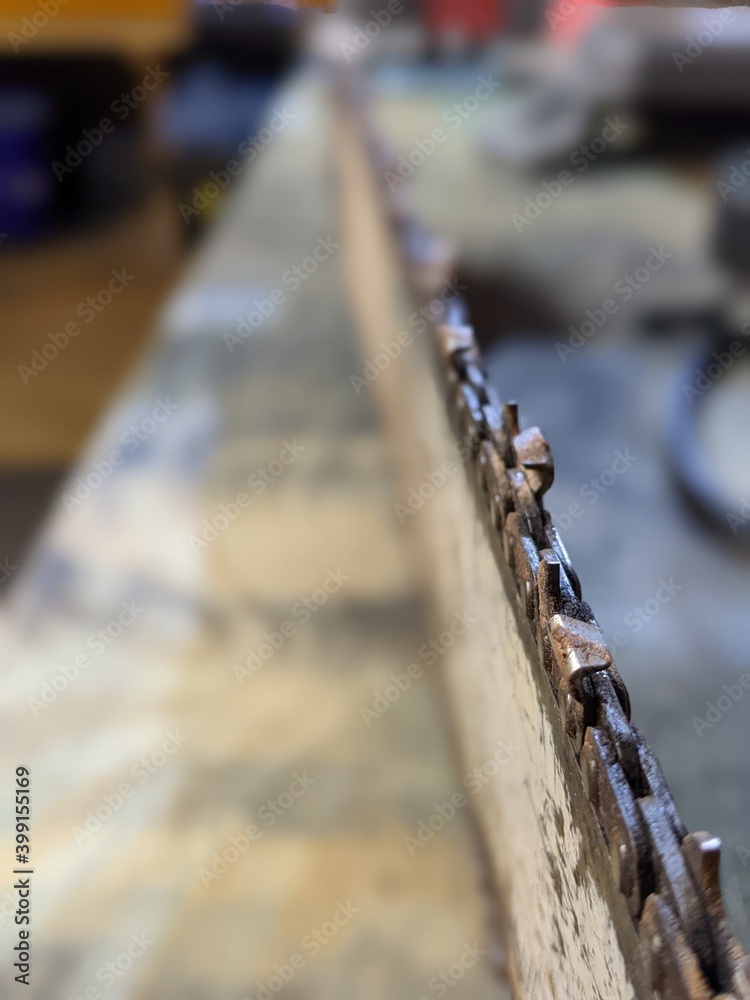 chainsaw chain shapening on shop table