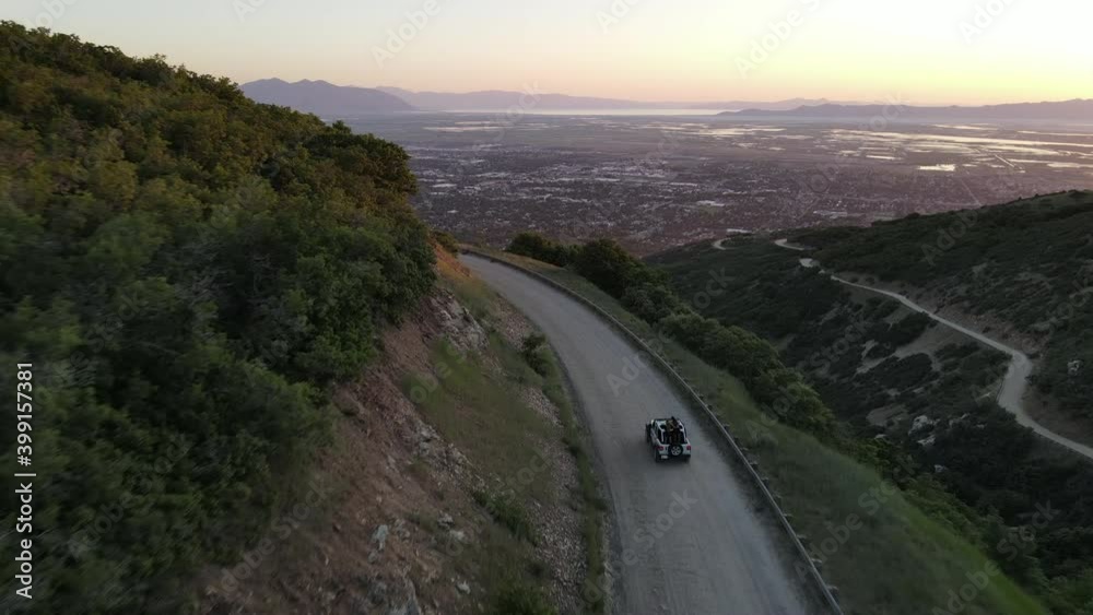 4K Aerial follow video of 4x4 off road vehicle on mountain trail at sunset 4K Aerial follow video of 4x4 off road vehicle on mountain trail at sunset