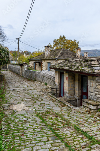 The picturesque village of Dilofo during fall season with its architectural traditional old stone  buildings located on Tymfi mount, Zagori, Epirus, Greece, Europe
 photo