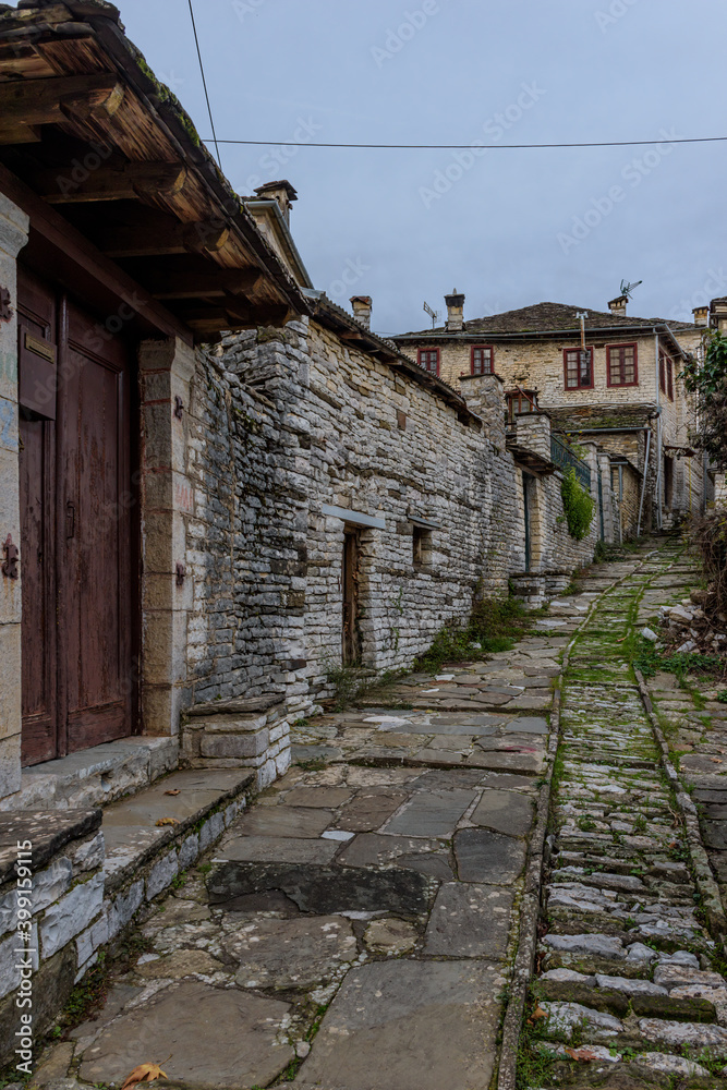 The picturesque village of Dilofo during fall season with its architectural traditional old stone  buildings located on Tymfi mount, Zagori, Epirus, Greece, Europe
