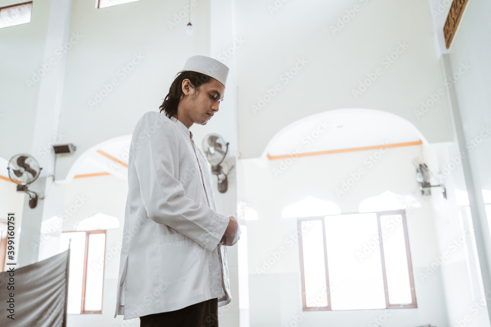 Man muslim doing prayer in the mosque Man muslim doing prayer in the mosque