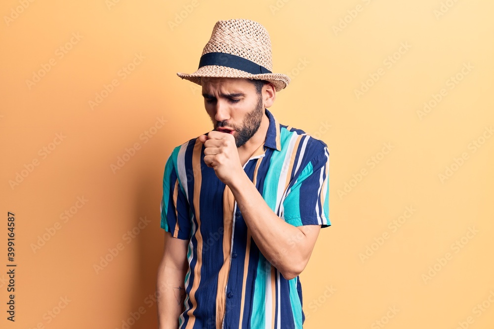 Young handsome man with beard wearing summer hat and shirt feeling unwell and coughing as symptom for cold or bronchitis. health care concept. Young handsome man with beard wearing summer hat and shirt feeling unwell and coughing as symptom for cold or bronchitis. health care concept.