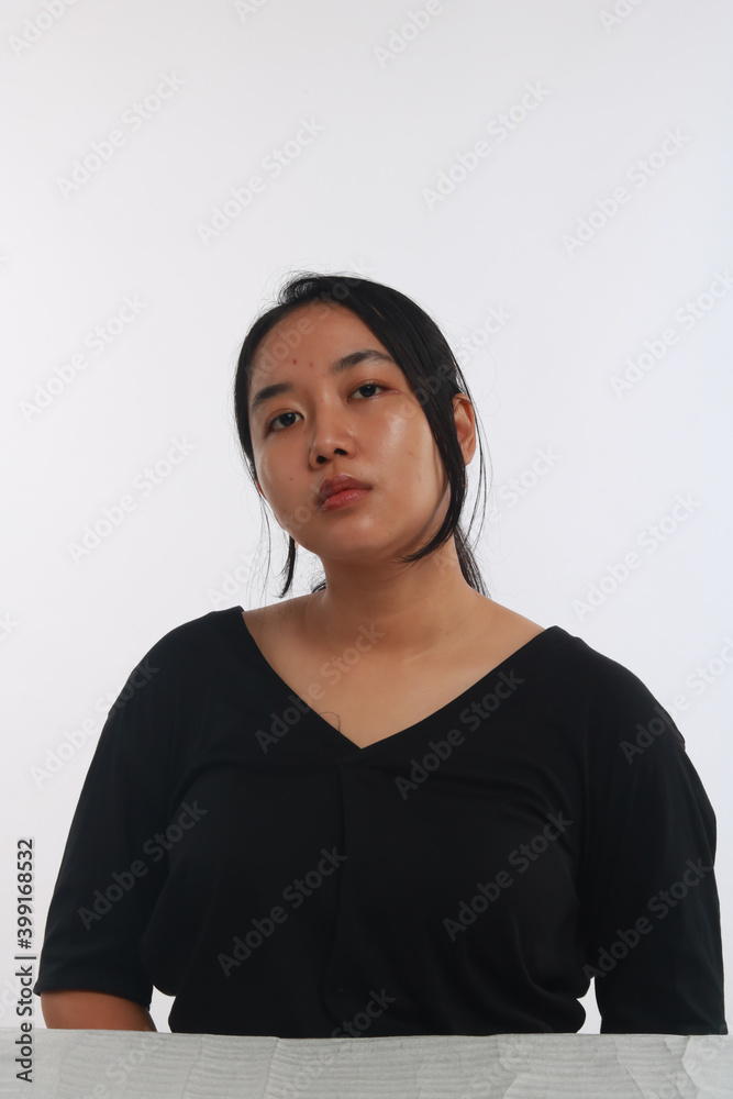 Young Asian woman with no make up on white background. Young Asian woman with no make up on white background.
