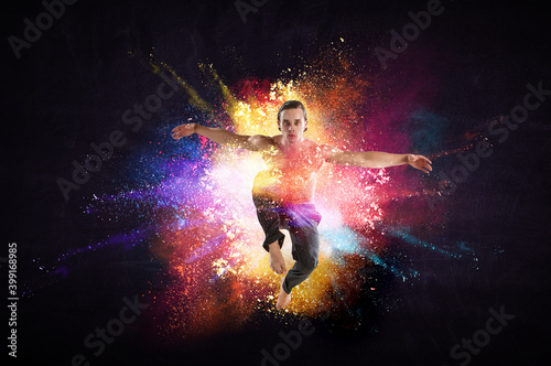 Male dancer against colourf...