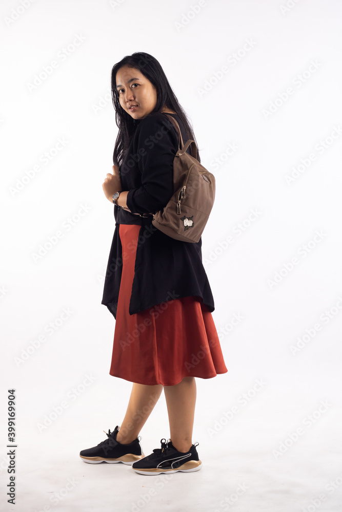 Girl college student carrying backpack. isolated over white. Girl college student carrying backpack. isolated over white.