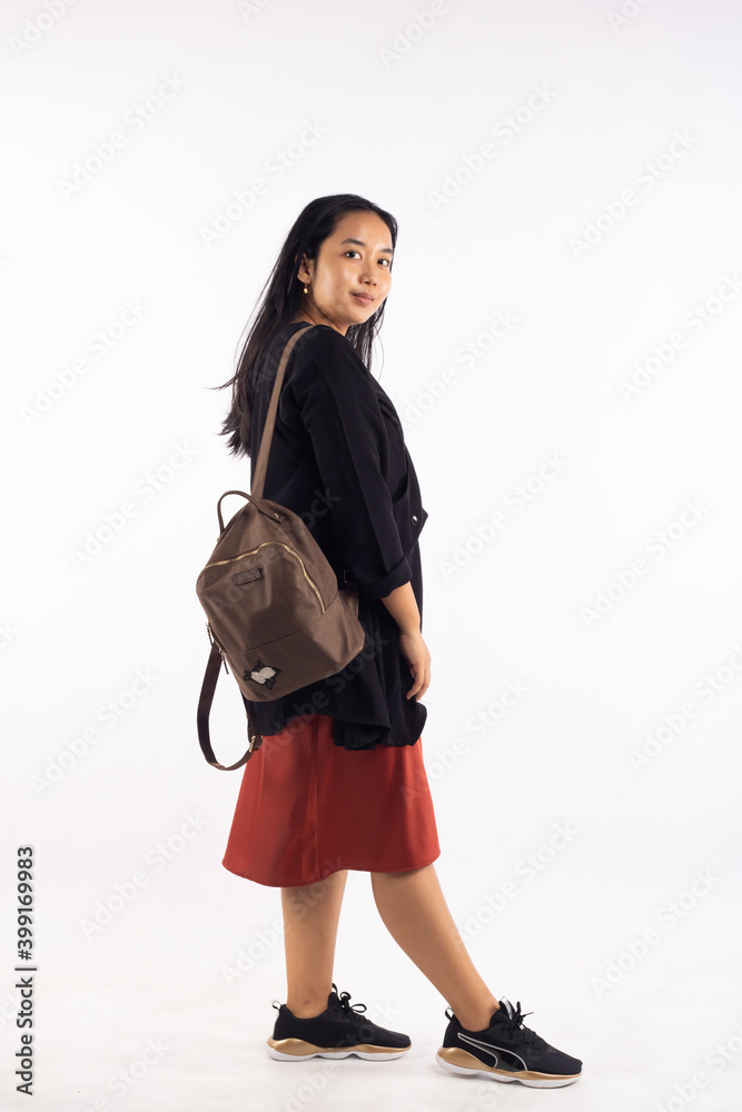 Girl college student carrying backpack. isolated over white. Girl college student carrying backpack. isolated over white.