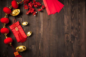 Chinese new year 2021 festival, Top view flat lay lunar new year or Happy Chinese new year decorations celebration with copy space on the wood background (Chinese character "fu" meaning fortune)