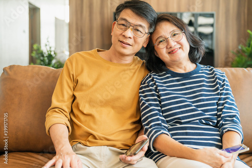 portrait asian happiness senior old age couple casual cloth sit relax casual leisure pleasure at home quarantine new normal lifestyle