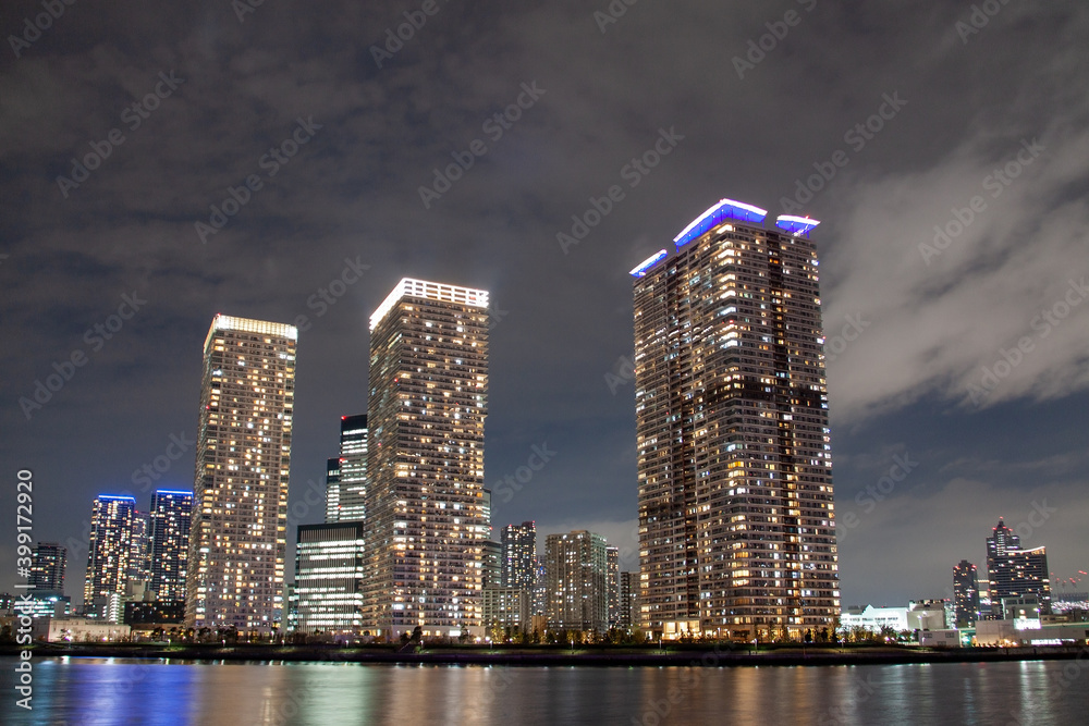 Illuminated high rise residential buildings in the night Illuminated high rise residential buildings in the night