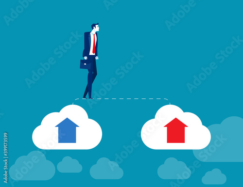 Businessman walks from old cloud to new cloud. Changing business photo