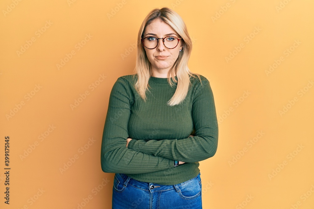 Young caucasian woman with arms crossed gesture skeptic and nervous, frowning upset because of problem. negative person.