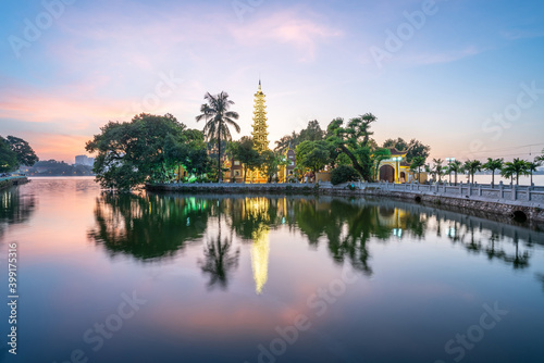 Panorama scene of Tran Quoc pagoda, the oldest temple in Hanoi, Vietnam, with brilliant sunset