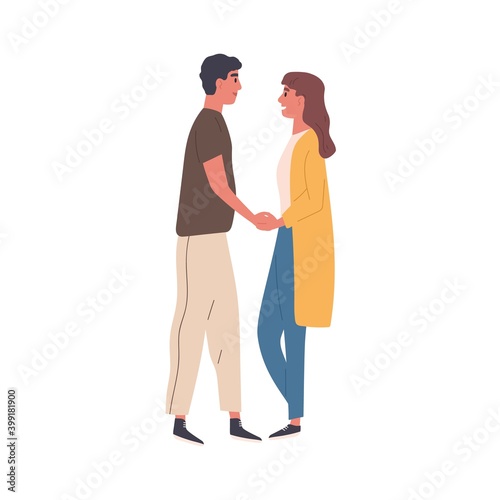 Romantic couple on a date. Enamored woman and man standing together and holdi...