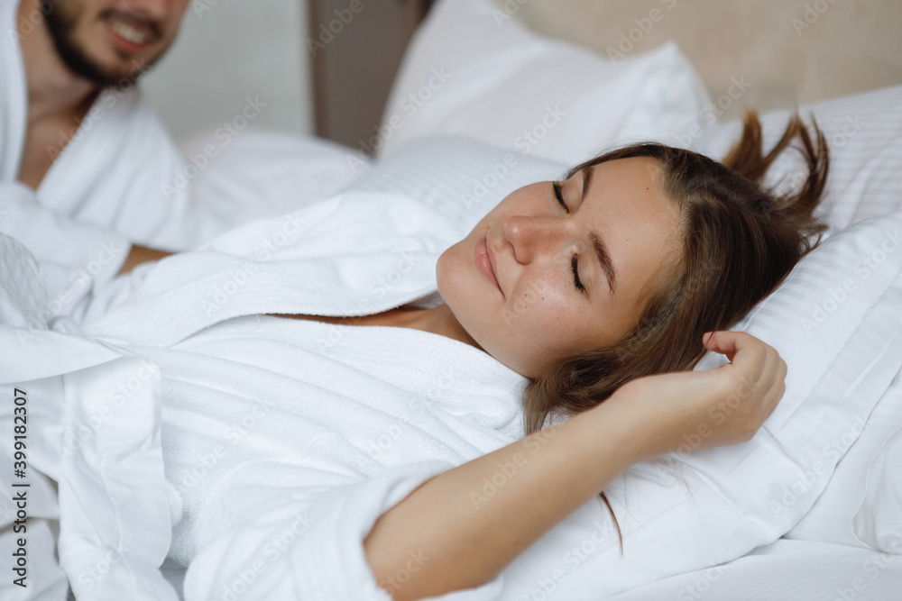 Young cute couple, man and woman in bed. Young cute couple, man and woman in bed.