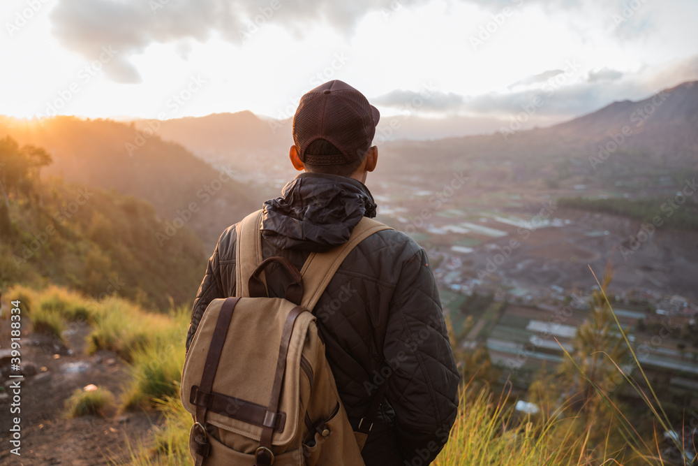 Portrait adventurous man with a backpack enjoying the mountain scenery Portrait adventurous man with a backpack enjoying the mountain scenery