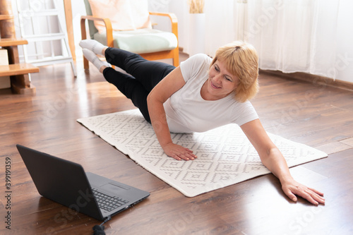 A woman is engaged in fitness and exercise at home.