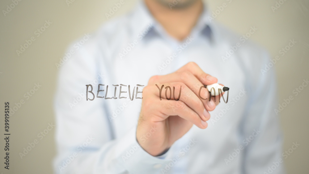 Believe You Can , man writing on transparent screen