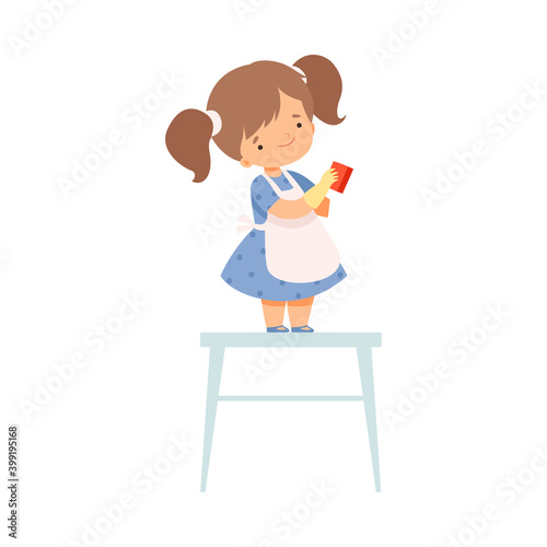 Cute Little Girl in Apron Standing on Chair with Rag Helping to Clean House Cartoon Style Vector Illustration